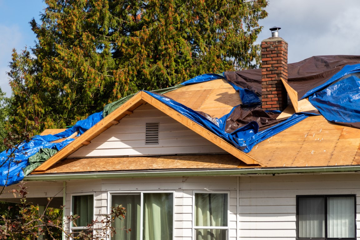 An image of a house with  an ongoing roof leak repair service